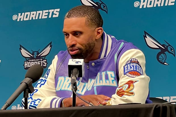 Charles Lee wears Dreamville jacket at pregame press conference