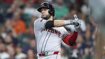 Sep 8, 2024; Houston, Texas, USA; Arizona Diamondbacks third baseman Eugenio Suarez (28) hits an RBI single during the third inning against the Houston Astros at Minute Maid Park. Mandatory Credit: Troy Taormina-Imagn Images