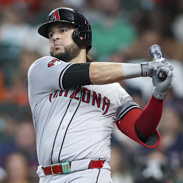 Sep 8, 2024; Houston, Texas, USA; Arizona Diamondbacks third baseman Eugenio Suarez (28) hits an RBI single during the third inning against the Houston Astros at Minute Maid Park. Mandatory Credit: Troy Taormina-Imagn Images