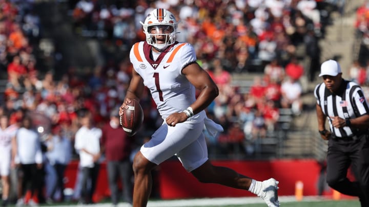 Sep 16, 2023; Piscataway, New Jersey, USA; Virginia Tech Hokies quarterback Kyron Drones (1) rolls out during the first half against the Rutgers Scarlet Knights at SHI Stadium. Mandatory Credit: Vincent Carchietta-USA TODAY Sports