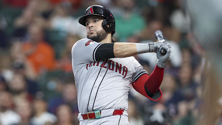 Sep 8, 2024; Houston, Texas, USA; Arizona Diamondbacks third baseman Eugenio Suarez (28) hits an RBI single during the third inning against the Houston Astros at Minute Maid Park. Mandatory Credit: Troy Taormina-Imagn Images