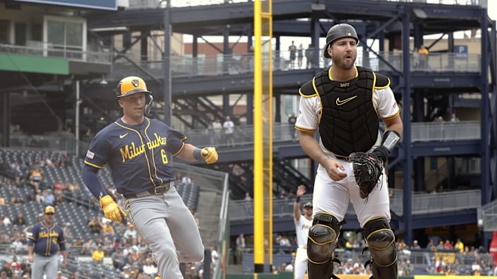 May 25, 2025; Pittsburgh, Pennsylvania, USA; Milwaukee Brewers left fielder Isaac Collins (6) scores a run on a Pirates error as catcher Joey Bart (14) looks for the ball during the first inning at PNC Park. Mandatory Credit: Charles LeClaire-Imagn Images May 25, 2025; Pittsburgh, Pennsylvania, USA; Milwaukee Brewers left fielder Isaac Collins (6) scores a run on a Pirates error as catcher Joey Bart (14) looks for the ball during the first inning at PNC Park. Mandatory Credit: Charles LeClaire-Imagn Images