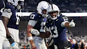Penn State Nittany Lions running back Kaytron Allen (13) celebrates with quarterback Ethan Grunkemeyer (17) after scoring a touchdown during the fourth quarter against the Nebraska Cornhuskers at Beaver Stadium. 