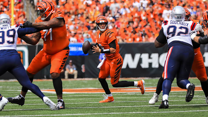 Sep 8, 2024; Cincinnati, Ohio, USA; Cincinnati Bengals quarterback Joe Burrow (9) runs with the ball against the New England Patriots in the first half at Paycor Stadium. Mandatory Credit: Katie Stratman-Imagn Images