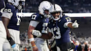 Penn State Nittany Lions running back Kaytron Allen (13) celebrates with quarterback Ethan Grunkemeyer (17) after scoring a touchdown during the fourth quarter against the Nebraska Cornhuskers at Beaver Stadium. 