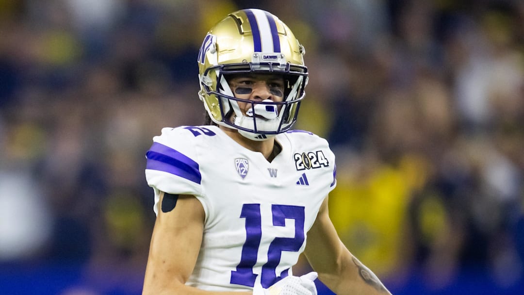 Jan 8, 2024; Houston, TX, USA; Washington Huskies wide receiver Denzel Boston (12) against the Michigan Wolverines during the 2024 College Football Playoff national championship game at NRG Stadium. Mandatory Credit: Mark J. Rebilas-Imagn Images