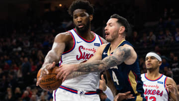 Dec 13, 2019; Philadelphia, PA, USA; Philadelphia 76ers center Joel Embiid (21) defends against New Orleans Pelicans guard JJ Redick (4) during the first quarter at Wells Fargo Center. Mandatory Credit: Bill Streicher-USA TODAY Sports