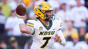 Aug 29, 2024; Boulder, Colorado, USA; North Dakota State Bison quarterback Cam Miller (7) scrambles in the second quarter against the Colorado Buffaloes at Folsom Field. Mandatory Credit: Ron Chenoy-Imagn Images
