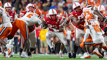 Nebraska running back Dante Dowdell rushes for a 7-yard gain against Illinois.