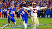 Florida Gators place kicker Trey Smack (29) reacts to a missed field goal in the final seconds of the first half as Florida State Seminoles defensive back Fentrell Cypress II (23) signals a miss at Steve Spurrier Field at Ben Hill Griffin Stadium in Gainesville, FL on Saturday, November 25, 2023. [Doug Engle/Gainesville Sun]