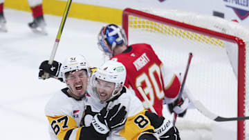 Jan 3, 2025; Sunrise, Florida, USA; Pittsburgh Penguins right wing Rickard Rakell (67) celebrates after scoring against the Florida Panthers during the third period at Amerant Bank Arena. Mandatory Credit: Rich Storry-Imagn Images