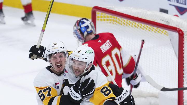 Jan 3, 2025; Sunrise, Florida, USA; Pittsburgh Penguins right wing Rickard Rakell (67) celebrates after scoring against the Florida Panthers during the third period at Amerant Bank Arena. Mandatory Credit: Rich Storry-Imagn Images