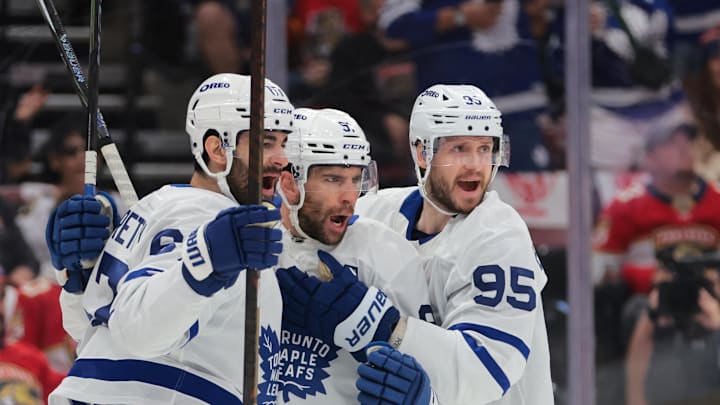 May 9, 2025; Sunrise, Florida, USA; Toronto Maple Leafs center John Tavares (91) celebrates with left wing Max Pacioretty (67) and defenseman Oliver Ekman-Larsson (95) after scoring against the Florida Panthers during the first period in game three of the second round of the 2025 Stanley Cup Playoffs at Amerant Bank Arena. Mandatory Credit: Sam Navarro-Imagn Images