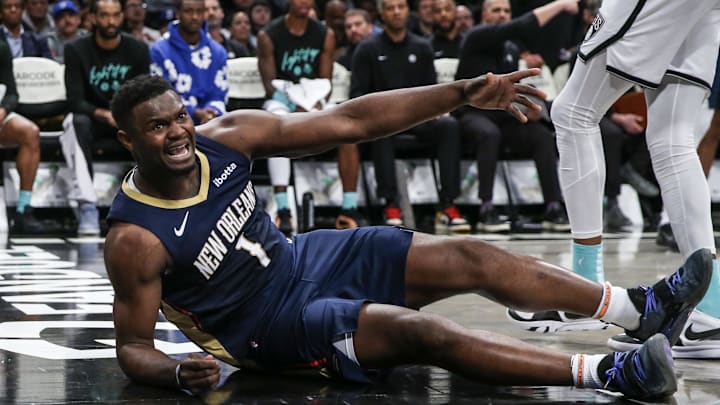 Mar 19, 2024; Brooklyn, New York, USA;  New Orleans Pelicans forward Zion Williamson (1) reacts after getting knocked to the floor in the second quarter against the Brooklyn Nets at Barclays Center. Mandatory Credit: Wendell Cruz-Imagn Images