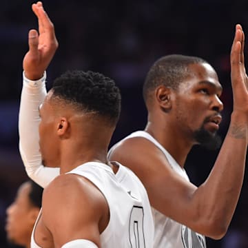 February 18, 2018; Los Angeles, CA, USA; Team Lebron forward Kevin Durant (35) of the Golden State Warriors and guard Russell Westbrook (0) of the Oklahoma City Thunder react in the second half of the 2018 NBA All Star Game at Staples Center. Mandatory Credit: Bob Donnan-Imagn Images