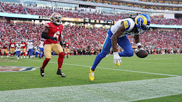Los Angeles Rams wide receiver Davante Adams (R) and San Francisco 49ers safety Malik Mustapha (L)