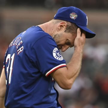 Jun 28, 2024; Baltimore, Maryland, USA; Texas Rangers pitcher Max Scherzer (31) reacts after giving up a third inning hit against the Texas Rangers  at Oriole Park at Camden Yards. 