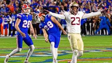 Florida Gators place kicker Trey Smack (29) reacts to a missed field goal in the final seconds of the first half as Florida State Seminoles defensive back Fentrell Cypress II (23) signals a miss at Steve Spurrier Field at Ben Hill Griffin Stadium in Gainesville, FL on Saturday, November 25, 2023. [Doug Engle/Gainesville Sun]