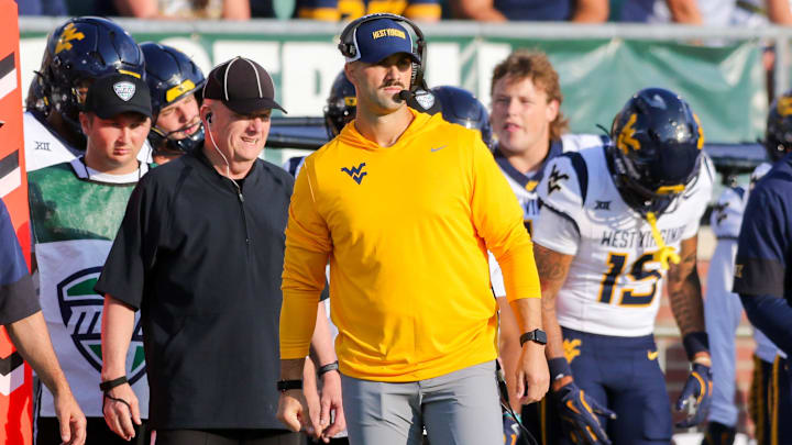 Sep 6, 2025; Athens, Ohio, USA; West Virginia Mountaineers defensive coordinator Zac Alley watches a play during the third quarter against the Ohio Bobcats at Peden Stadium. Mandatory Credit: Ben Queen-Imagn Images Sep 6, 2025; Athens, Ohio, USA; West Virginia Mountaineers defensive coordinator Zac Alley watches a play during the third quarter against the Ohio Bobcats at Peden Stadium. Mandatory Credit: Ben Queen-Imagn Images