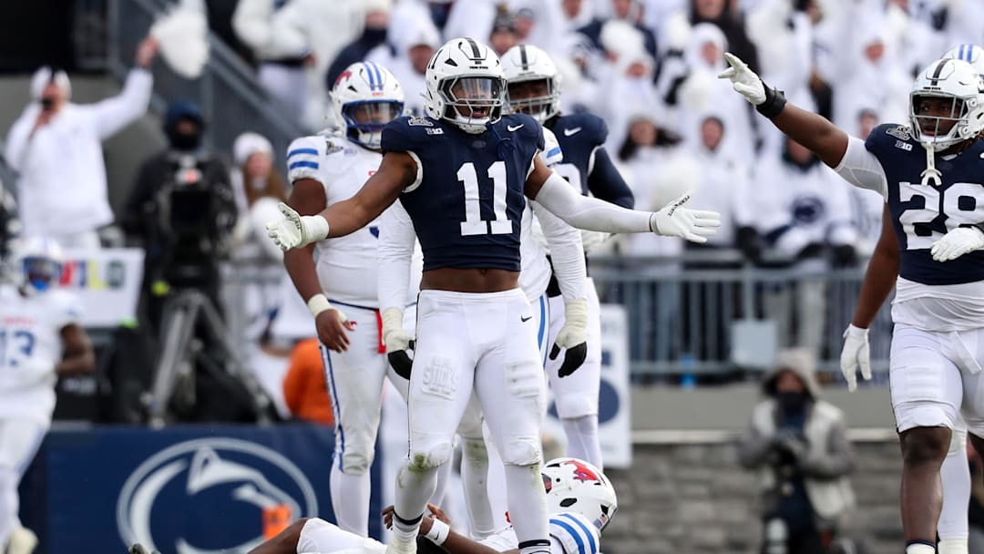 Dec 21, 2024; University Park, Pennsylvania, USA; Penn State Nittany Lions defensive end Abdul Carter (11) reacts after sacking Southern Methodist Mustangs quarterback Kevin Jennings (7) during the third quarter in the first round of the College Football Playoff at Beaver Stadium. Mandatory Credit: Matthew O'Haren-Imagn Images