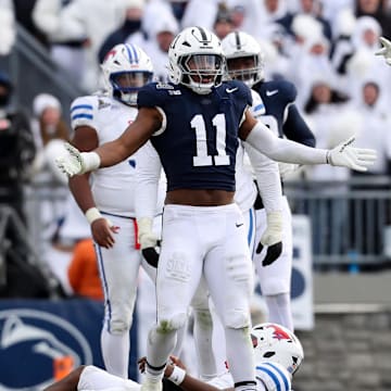 Dec 21, 2024; University Park, Pennsylvania, USA; Penn State Nittany Lions defensive end Abdul Carter (11) reacts after sacking Southern Methodist Mustangs quarterback Kevin Jennings (7) during the third quarter in the first round of the College Football Playoff at Beaver Stadium. Mandatory Credit: Matthew O'Haren-Imagn Images
