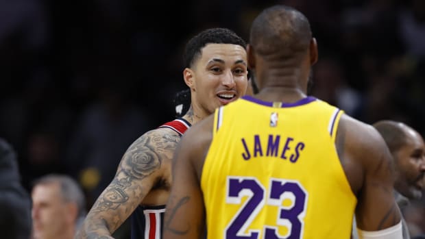 Apr 3, 2024; Washington, District of Columbia, USA; Washington Wizards forward Kyle Kuzma (33) talks with Los Angeles Lakers forward LeBron James (23) after their game at Capital One Arena. Mandatory Credit: Geoff Burke-USA TODAY Sports