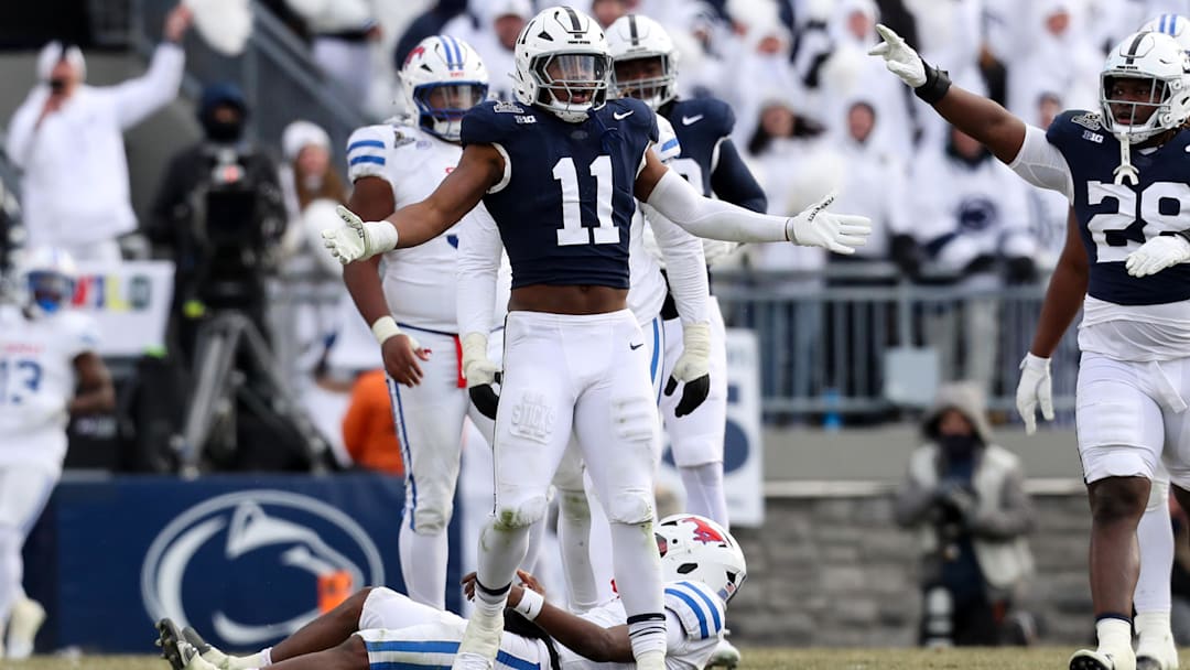 Dec 21, 2024; University Park, Pennsylvania, USA; Penn State Nittany Lions defensive end Abdul Carter (11) reacts after sacking Southern Methodist Mustangs quarterback Kevin Jennings (7) during the third quarter in the first round of the College Football Playoff at Beaver Stadium. Mandatory Credit: Matthew O'Haren-Imagn Images