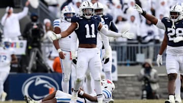 Dec 21, 2024; University Park, Pennsylvania, USA; Penn State Nittany Lions defensive end Abdul Carter (11) reacts after sacking Southern Methodist Mustangs quarterback Kevin Jennings (7) during the third quarter in the first round of the College Football Playoff at Beaver Stadium. Mandatory Credit: Matthew O'Haren-Imagn Images