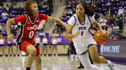 Taylor Bigby drives against Cincinnati.