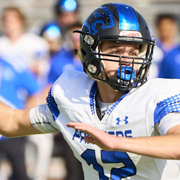 Paradise Honors Panthers quarterback Gage Baker (12) makes a pass against Valley Christian Trojans at Mesa High School in Mesa on Saturday, Nov. 18, 2023. Alex Gould/Special for The Republic