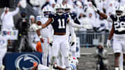Dec 21, 2024; University Park, Pennsylvania, USA; Penn State Nittany Lions defensive end Abdul Carter (11) reacts after sacking Southern Methodist Mustangs quarterback Kevin Jennings (7) during the third quarter in the first round of the College Football Playoff at Beaver Stadium.  
