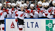 Dec 2, 2024; New York, New York, USA;  New Jersey Devils center Jack Hughes (86) celebrates his goal with teammates against the New York Rangers during the second period at Madison Square Garden. Mandatory Credit: Dennis Schneidler-Imagn Images