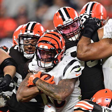 Oct 31, 2022; Cleveland, Ohio, USA; Cincinnati Bengals running back Joe Mixon (28) is tackled by Cleveland Browns linebacker Sione Takitaki (44), safety Grant Delpit (22) and defensive tackle Taven Bryan (99) during the third quarter at FirstEnergy Stadium. Mandatory Credit: David Dermer-Imagn Images