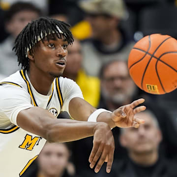Feb 8, 2025; Columbia, Missouri, USA; Missouri Tigers guard Anthony Robinson II (0) passes the ball during the second half against the Texas A&M Aggies at Mizzou Arena. Mandatory Credit: Jay Biggerstaff-Imagn Images