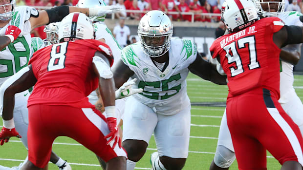 Sep 9, 2023; Lubbock, Texas, USA; Oregon Ducks offensive guard Marcus Harper II (65) blocks Texas Tech Red Raiders defensive 