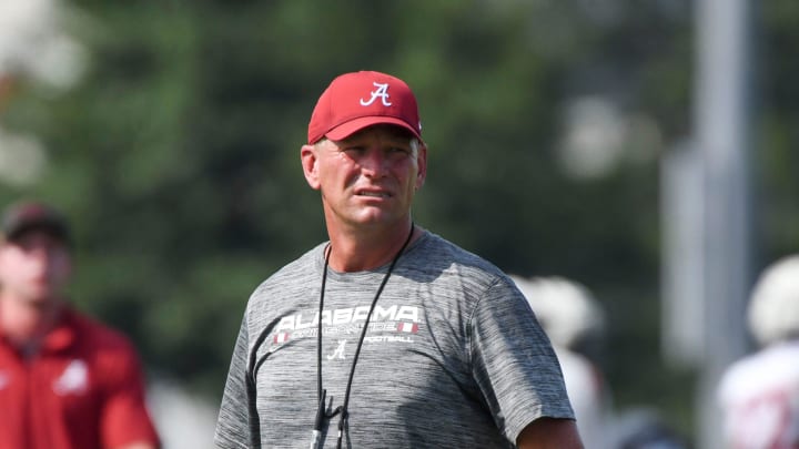 The Crimson Tide works out on the first day of practice for the 2024 season Wednesday, July 31, 2024. Alabama head coach Kalen DeBoer watches as his players go through the very hot morning of practice.