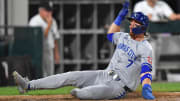 Jul 30, 2024; Chicago, Illinois, USA; Kansas City Royals shortstop Bobby Witt Jr. (7) slides into home plate to score a run during the eighth inning against the Chicago White Sox at Guaranteed Rate Field.