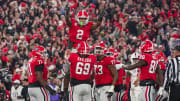 Nov 11, 2023; Athens, Georgia, USA; Georgia Bulldogs running back Kendall Milton (2) reacts with offensive lineman Tate Ratledge (69) after scoring a touchdown against the Mississippi Rebels during the first half at Sanford Stadium. Mandatory Credit: Dale Zanine-USA TODAY Sports