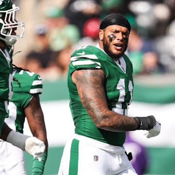 Oct 19, 2025; East Rutherford, New Jersey, USA; New York Jets linebacker Jermaine Johnson (11) celebrates a defensive stop in the first quarter against the Carolina Panthers at MetLife Stadium. Mandatory Credit: Vincent Carchietta-Imagn Images