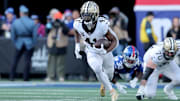 New Orleans Saints running back Alvin Kamara runs with the ball against the New York Giants during the second quarter at MetLife Stadium. 