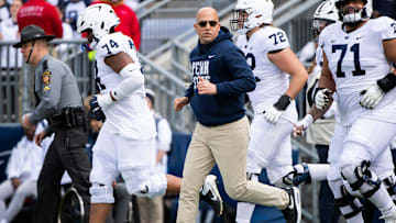 Penn State head coach James Franklin leads the Nittany Lions onto the field for the 2025 Blue-White game at Beaver Stadium.