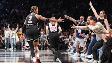 May 17, 2025; Brooklyn, New York, USA;  New York Liberty guard Natasha Cloud (9) celebrates after scoring in the fourth quarter against the Las Vegas Aces at Barclays Center. Mandatory Credit: Wendell Cruz-Imagn Images