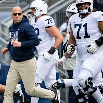 Penn State football coach James Franklin leads the Nittany Lions onto the field for the Blue-White Game at Beaver Stadium. 