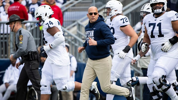 Penn State football coach James Franklin leads the Nittany Lions onto the field for the Blue-White Game at Beaver Stadium. 