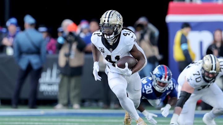 Dec 8, 2024; East Rutherford, New Jersey, USA; New Orleans Saints running back Alvin Kamara (41) runs with the ball against the New York Giants during the second quarter at MetLife Stadium. Mandatory Credit: Brad Penner-Imagn Images