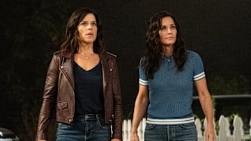 Neve Campbell (“Sidney Prescott”), left, and Courteney Cox (“Gale Weathers”) star in Paramount Pictures and Spyglass Media Group's "Scream." Photo by Brownie Harris.
