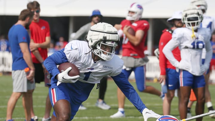 Bills wide receiver Curtis Samuel puts out the stiff arm.