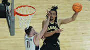 Purdue forward Trey Kaufman-Renn (4) shoots over Connecticut's Alex Karaban (11) in the 2024 national championship game. 