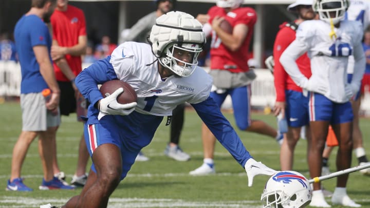 Bills wide receiver Curtis Samuel puts out the stiff arm.