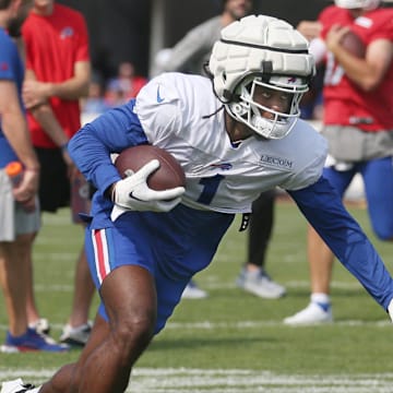 Bills wide receiver Curtis Samuel puts out the stiff arm.